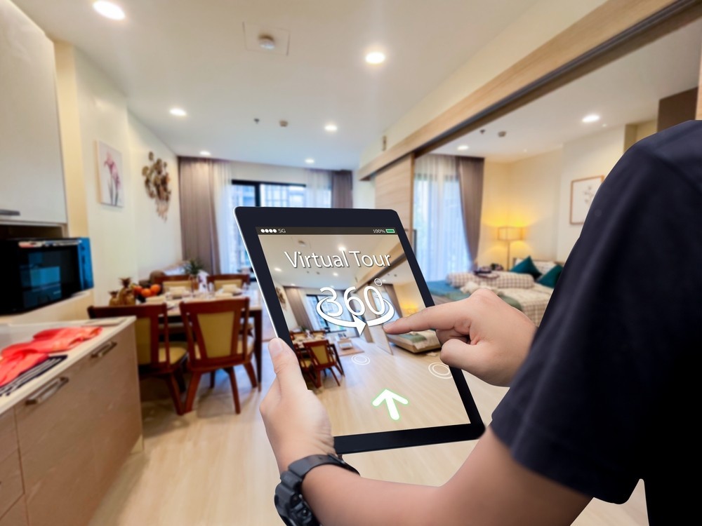 Virtual tour 360 for real estate technology concept.Man hands holding digital tablet Image of a 360 Virtual tour for real estate technology concept. Man hands holding digital tablet